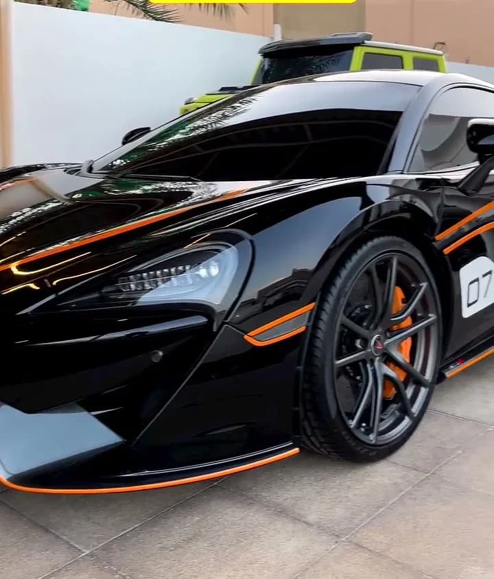 McLaren with tinted windows, at the owner's home