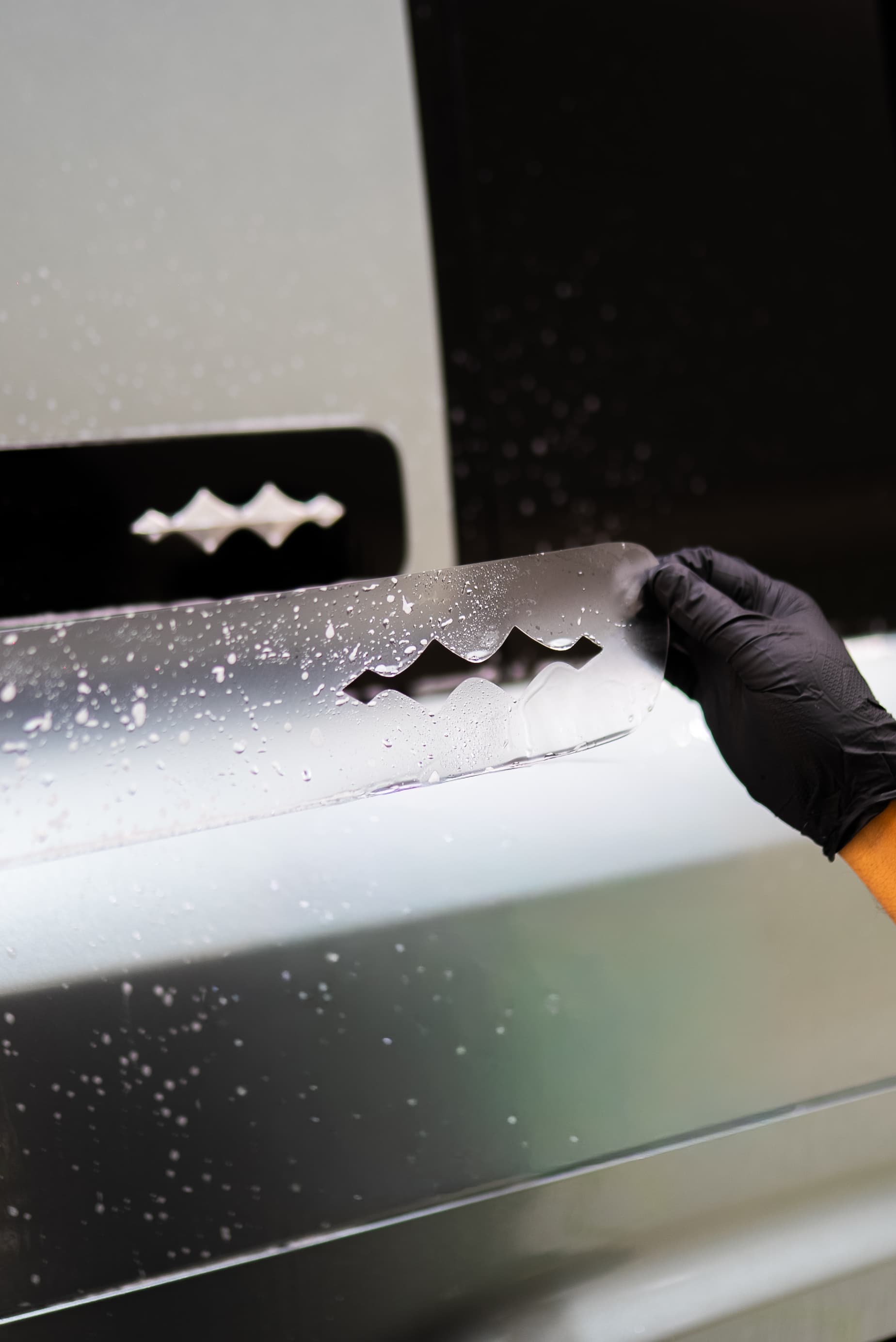 Hand-finished paint protection film seam on a vehicle panel