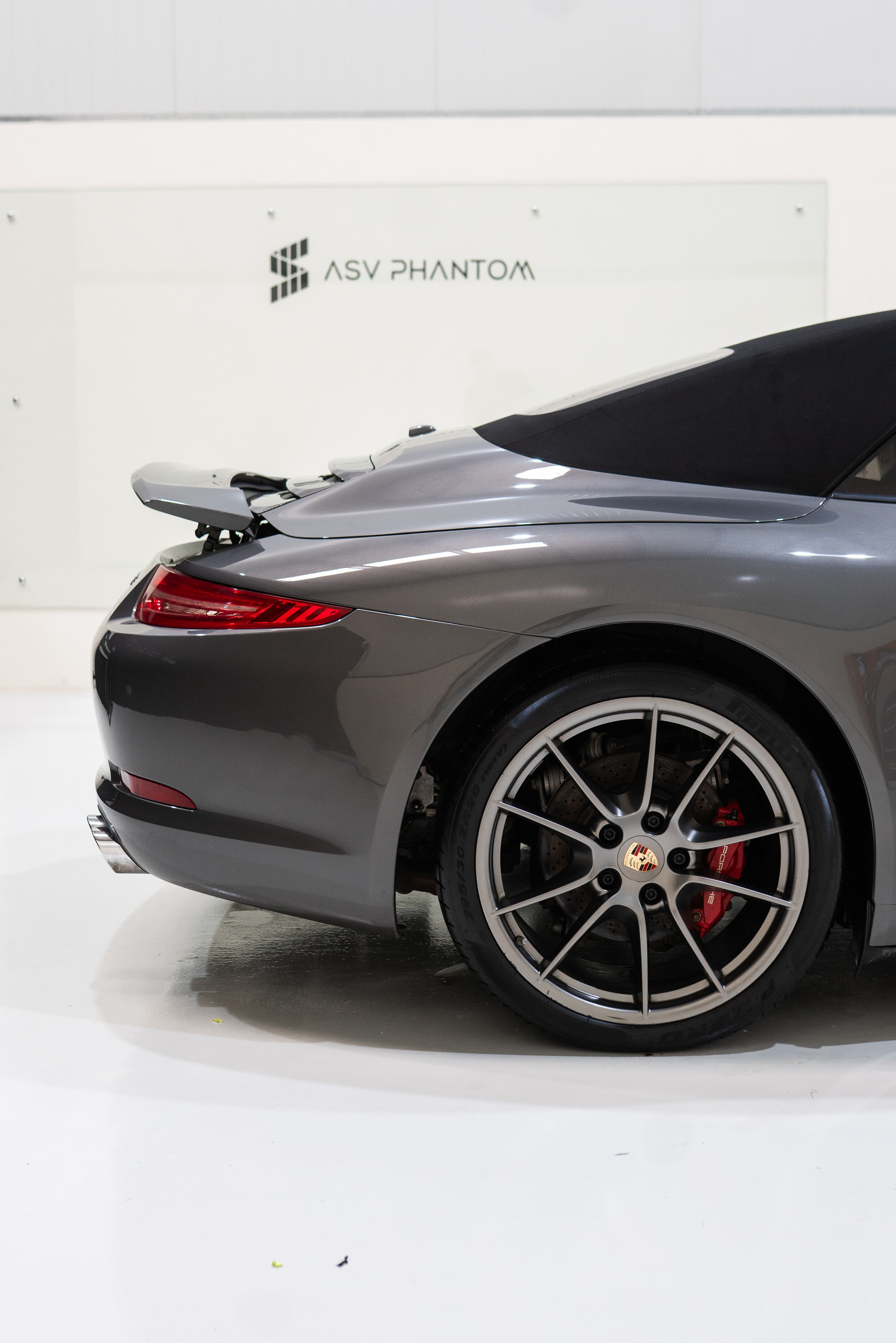 Porsche 911 wheel and door detail showing ceramic-coated paint gloss at ASV Phantom Dubai