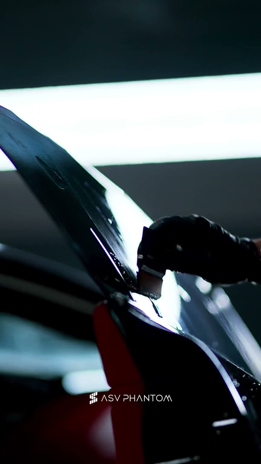 Ceramic window tint film installation on a luxury car at ASV Phantom Dubai